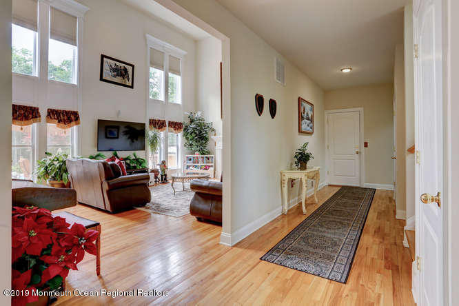 58 Fort Plains Road Howell, NJ 07731 - Photo 12 of 33 a living room with furniture and a fireplace