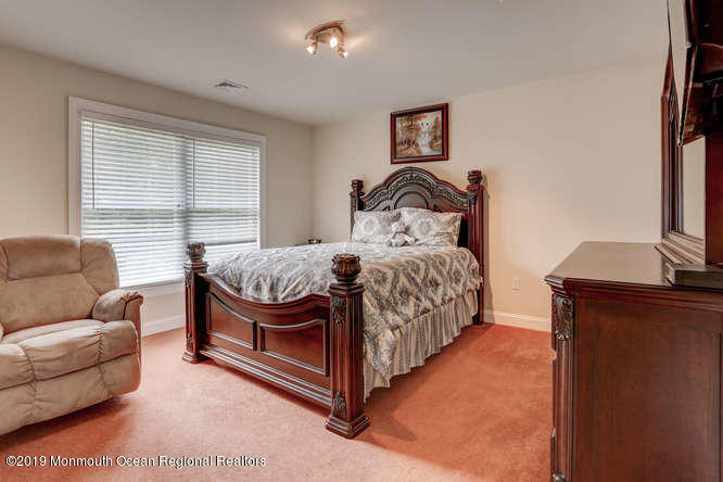 58 Fort Plains Road Howell, NJ 07731 - Photo 18 of 33 a bedroom with a bed couch and a window