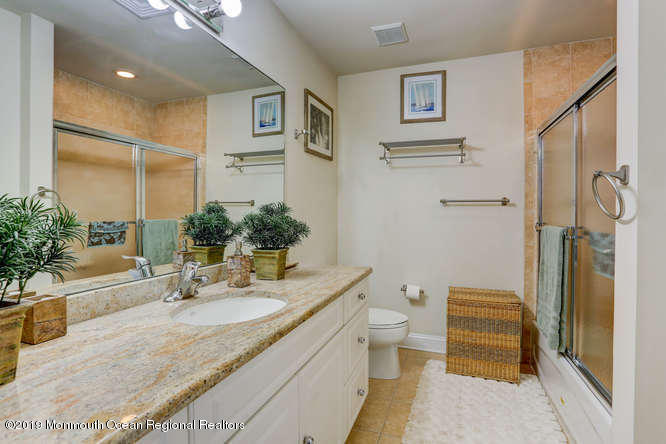 58 Fort Plains Road Howell, NJ 07731 - Photo 22 of 33 a bathroom with a granite countertop sink toilet and a mirror