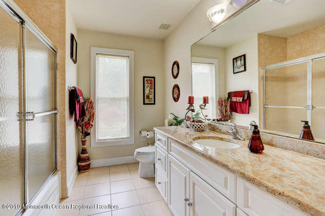 58 Fort Plains Road Howell, NJ 07731 - Photo 23 of 33 a bathroom with a sink double vanity and a shower