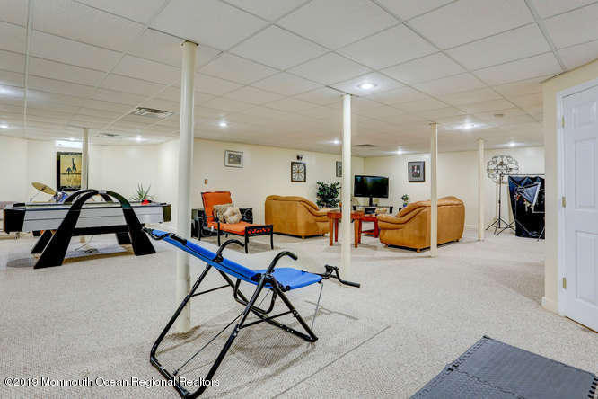 58 Fort Plains Road Howell, NJ 07731 - Photo 27 of 33 a room with lots of chairs and mirrors