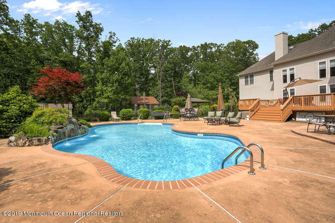 58 Fort Plains Road Howell, NJ 07731 - Photo 29 of 33 a view of a swimming pool with a patio