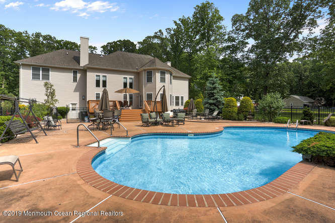 58 Fort Plains Road Howell, NJ 07731 - Photo 30 of 33 a view of a house with swimming pool and sitting area