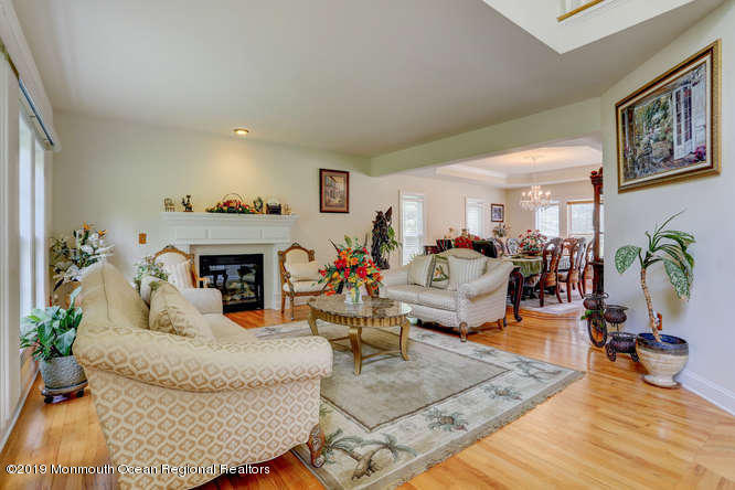 58 Fort Plains Road Howell, NJ 07731 - Photo 4 of 33 a living room with furniture and a fireplace