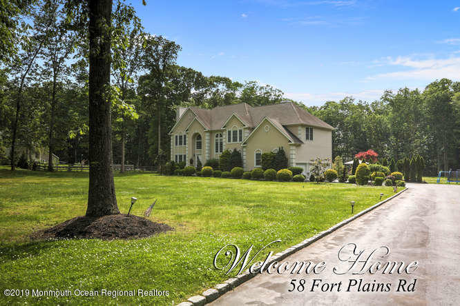 58 Fort Plains Road Howell, NJ 07731 - Photo 32 of 33 a front view of a house with garden