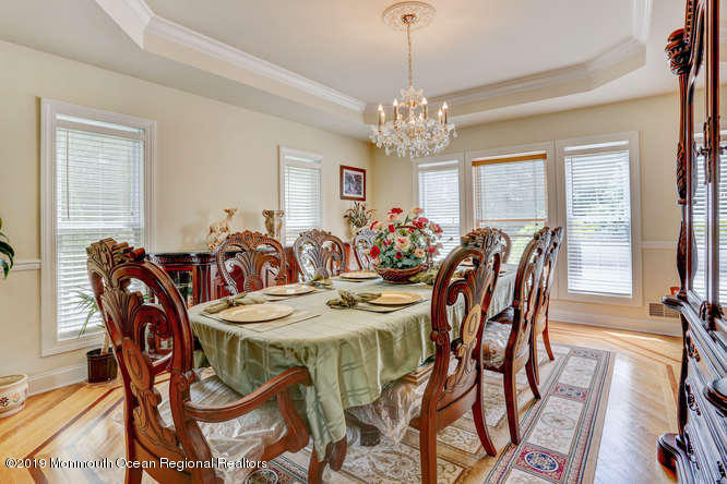 58 Fort Plains Road Howell, NJ 07731 - Photo 5 of 33 a view of a dining room with furniture window and wooden floor