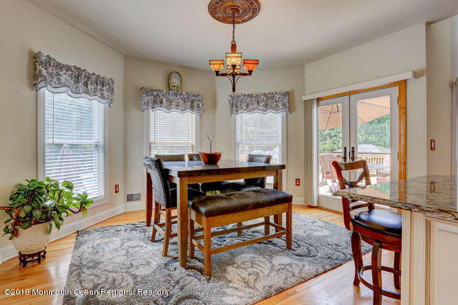 58 Fort Plains Road Howell, NJ 07731 - Photo 8 of 33 a living room with furniture a window and a potted plant