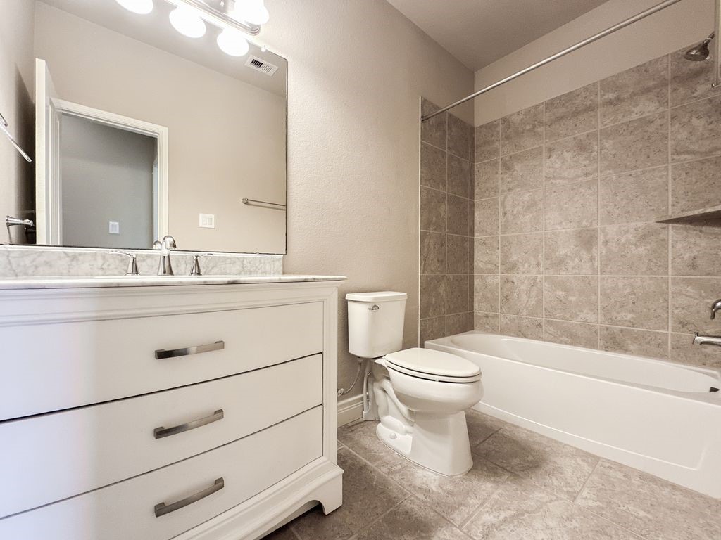 10 Pilot Rock Place Tomball, TX 77375 - Photo 18 of 38 a bathroom with a sink a toilet and shower