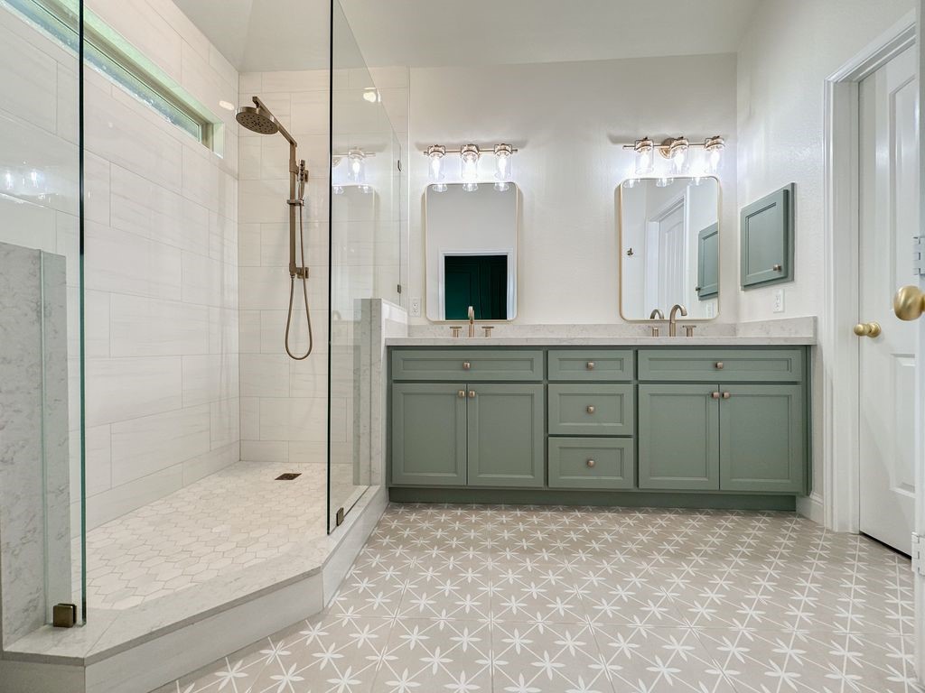 10 Pilot Rock Place Tomball, TX 77375 - Photo 30 of 38 a spacious bathroom with a mirror sink and shower
