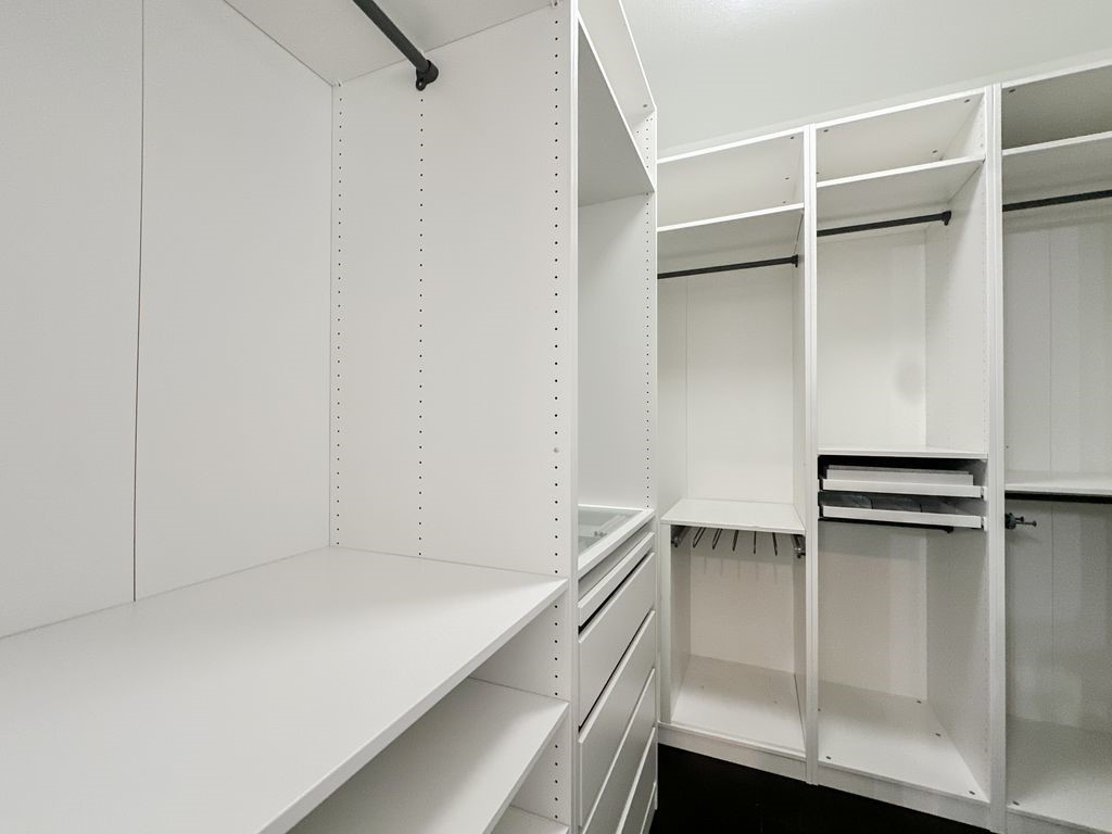 10 Pilot Rock Place Tomball, TX 77375 - Photo 32 of 38 a view of walk in closet with empty racks