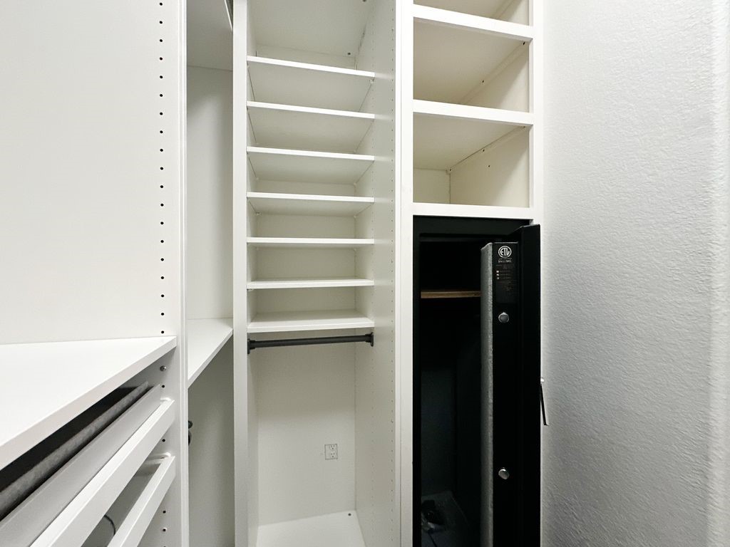 10 Pilot Rock Place Tomball, TX 77375 - Photo 34 of 38 a view of walk in closet with empty racks
