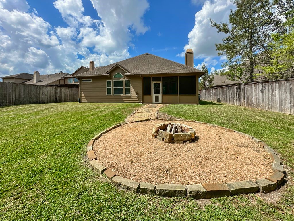 10 Pilot Rock Place Tomball, TX 77375 - Photo 35 of 38 a view of a house with backyard and sitting area