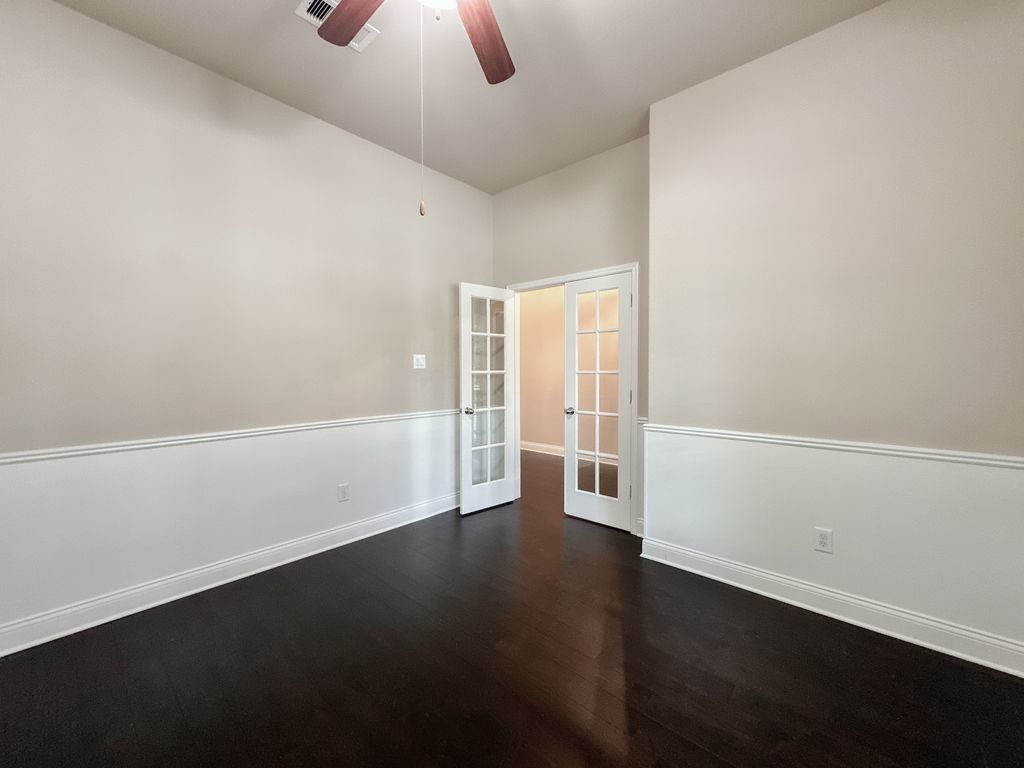 10 Pilot Rock Place Tomball, TX 77375 - Photo 5 of 38 an empty room with wooden floor and windows