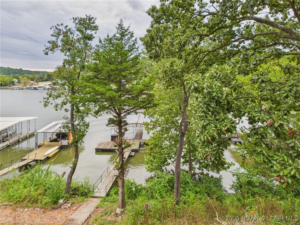 28468 Possum Trot Road Stover, MO 65078 - Photo 13 of 28 Stairs down to the dock