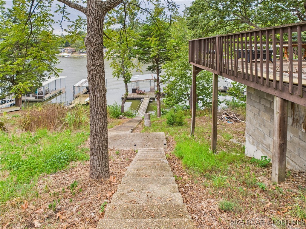 28468 Possum Trot Road Stover, MO 65078 - Photo 14 of 28 Stairs down to the dock