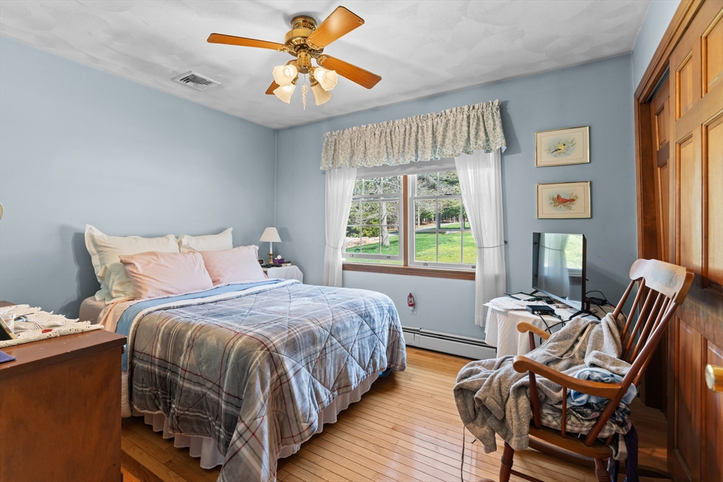 36 High Street Freetown, MA 02702 - Photo 20 of 42 a bedroom with a bed and wooden floor