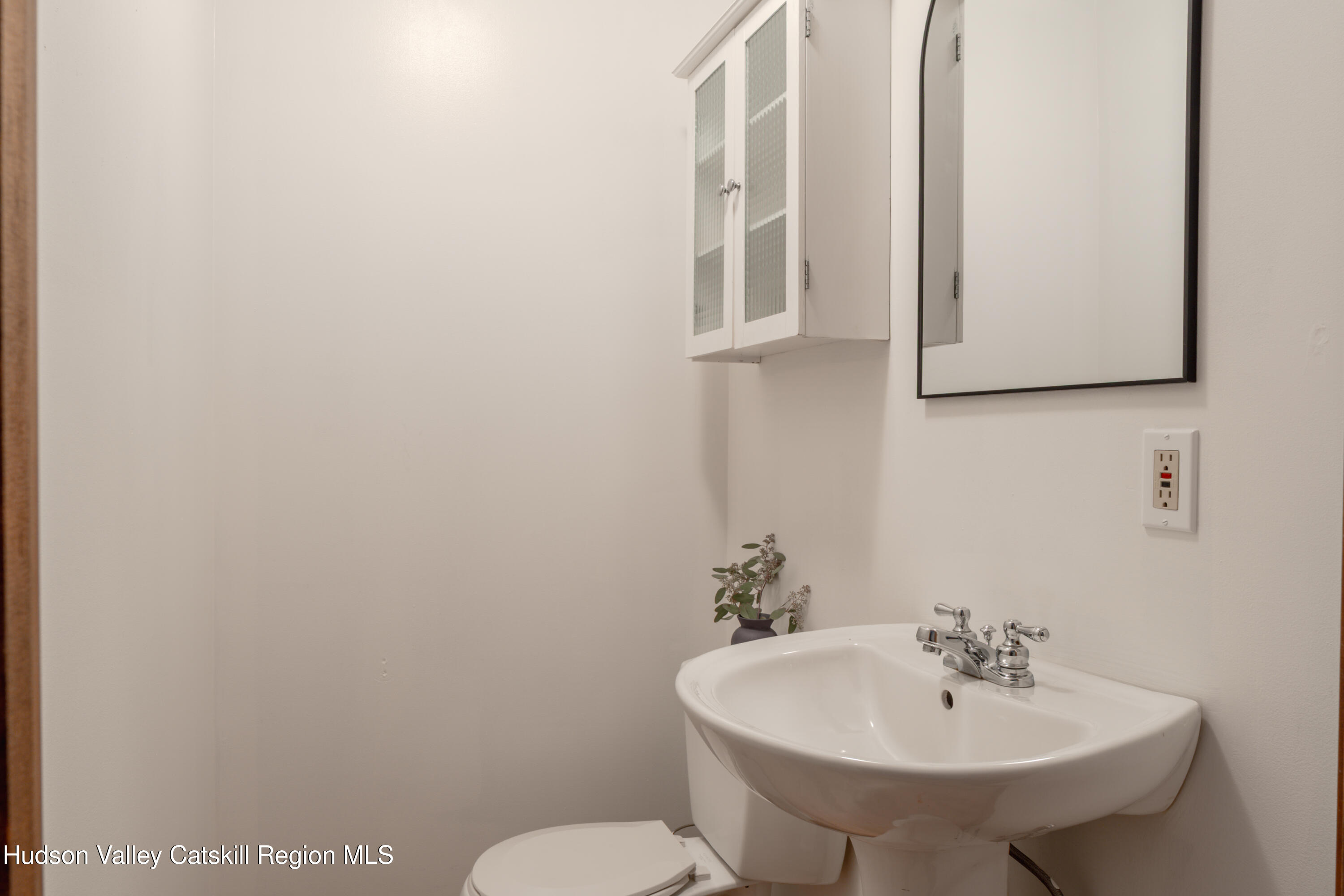 12 Glow Court Athens, NY 12015 - Photo 17 of 22 a bathroom with a toilet sink and mirror