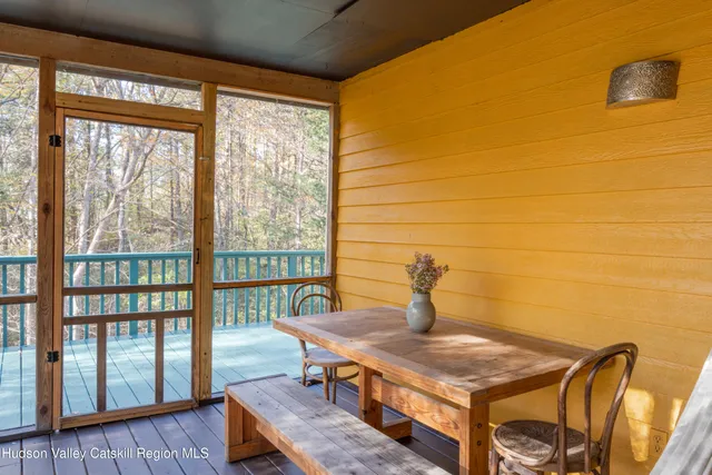 a balcony with wooden floor and fence