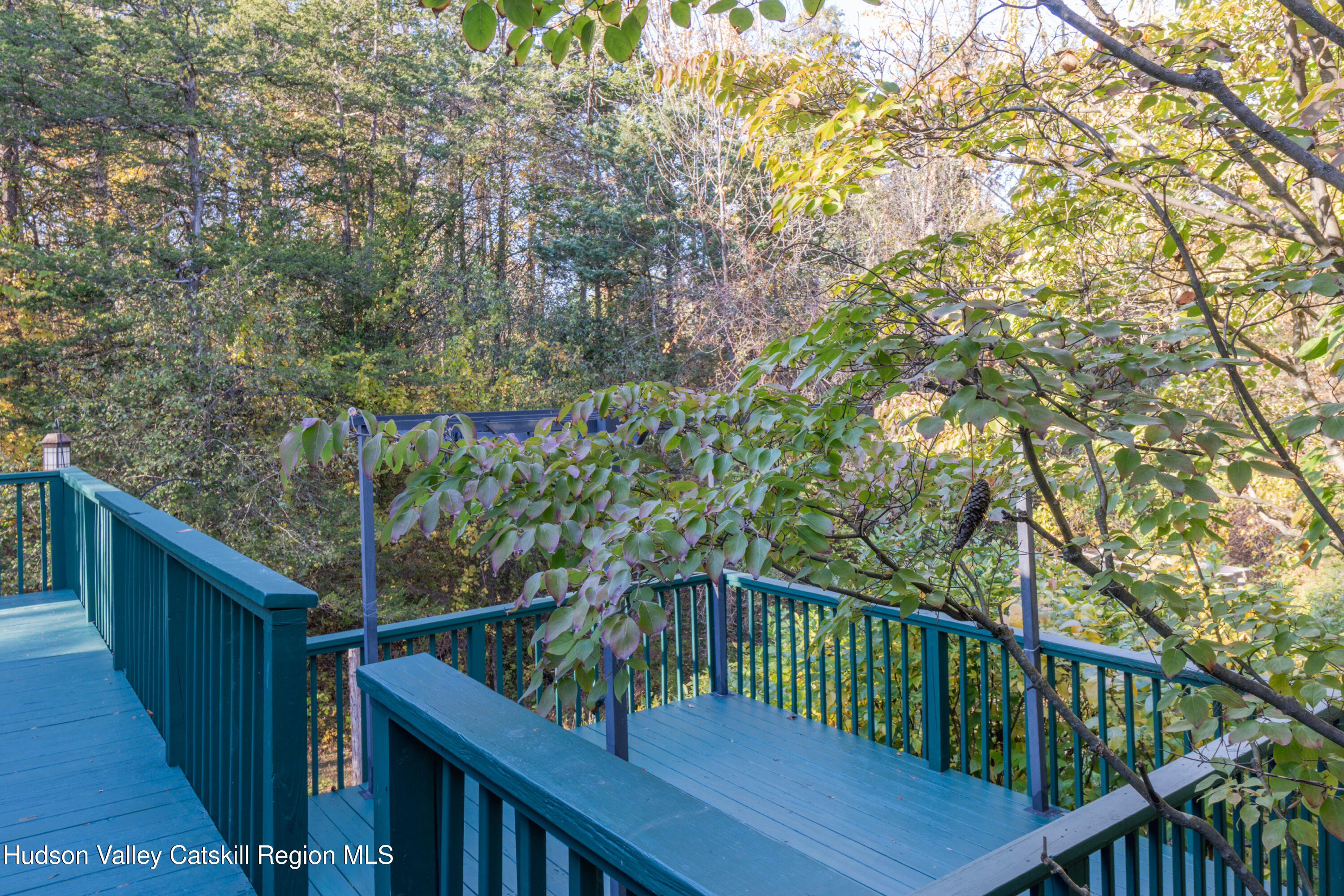 12 Glow Court Athens, NY 12015 - Photo 20 of 22 a balcony with wooden floor and fence