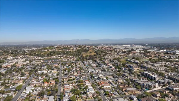 an aerial view of residential building and parking space