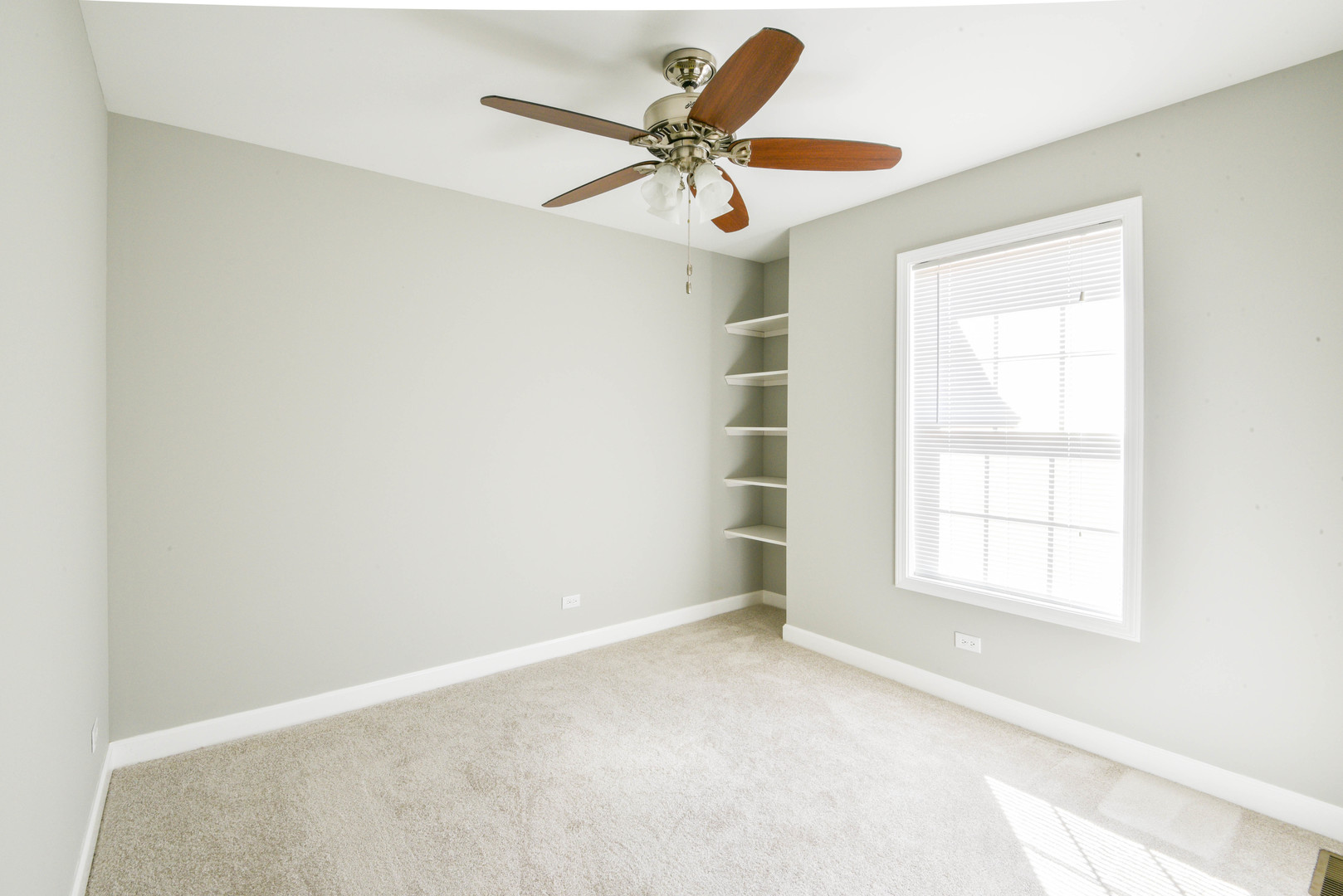 44 Forestview Lane Aurora, IL 60502 - Photo 12 of 18 an empty room with a window and a ceiling fan