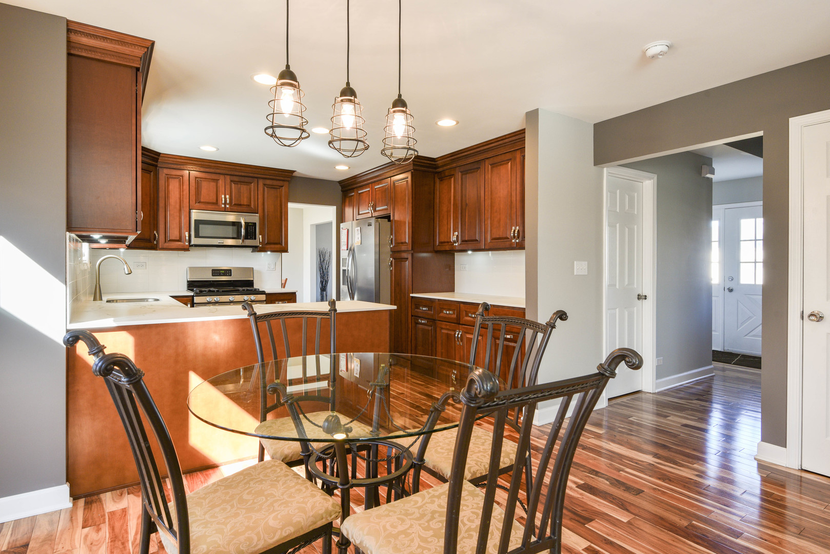 44 Forestview Lane Aurora, IL 60502 - Photo 6 of 18 a view of a dining room with furniture a chandelier and wooden floor