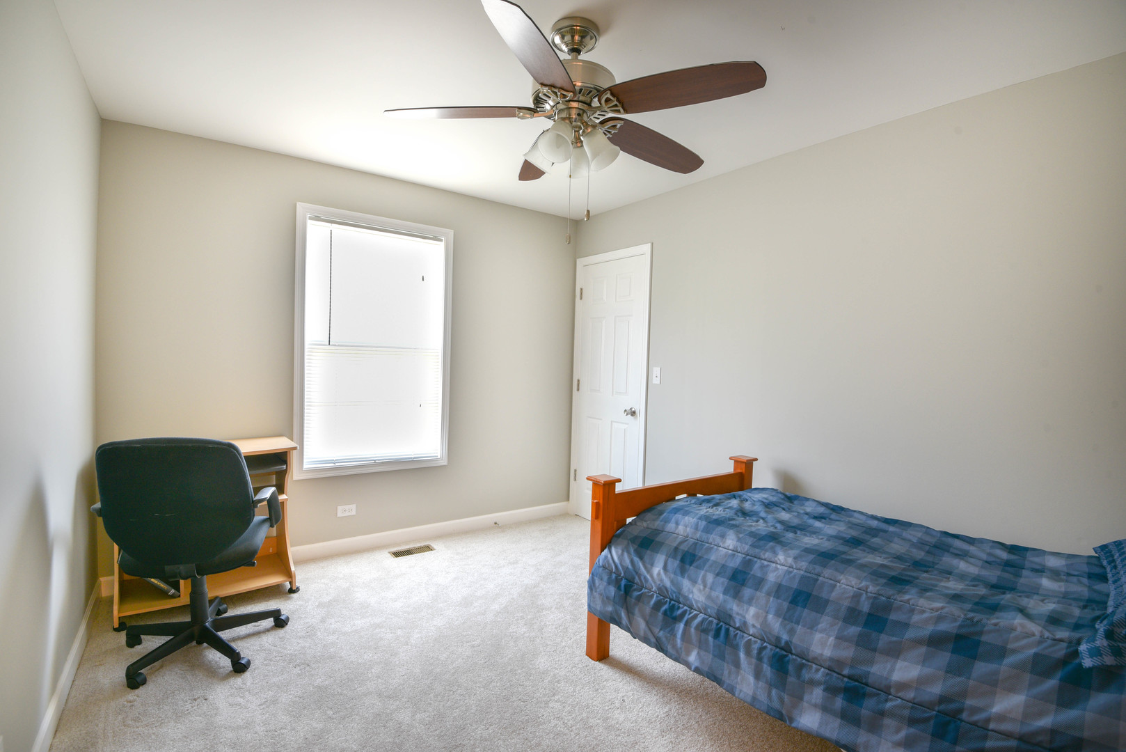 44 Forestview Lane Aurora, IL 60502 - Photo 10 of 18 a bedroom with a bed and a chair