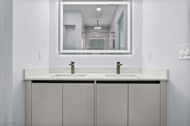 a bathroom with a sink and a vanity