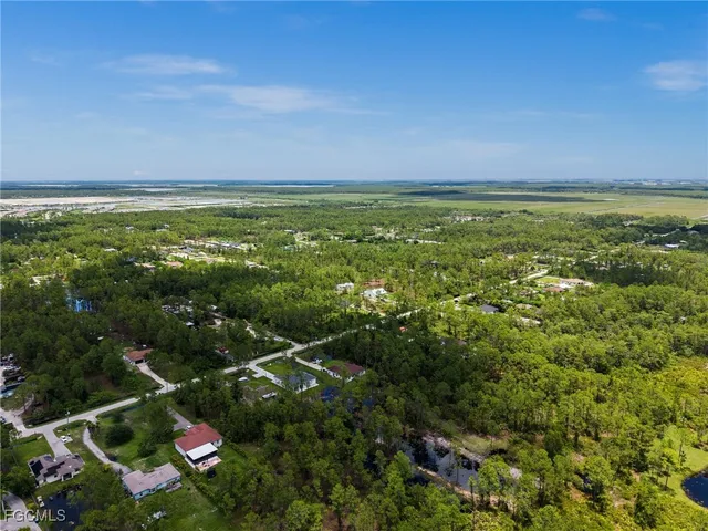 a view of a field with an ocean