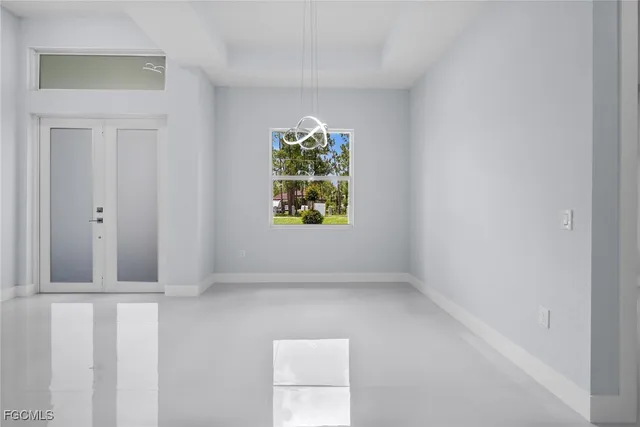 a view of an empty room with a window