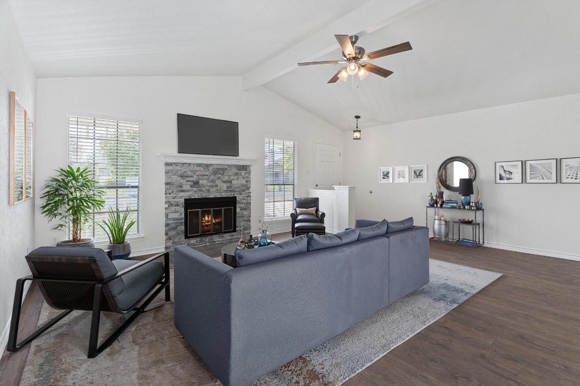 a living room with furniture and a fireplace