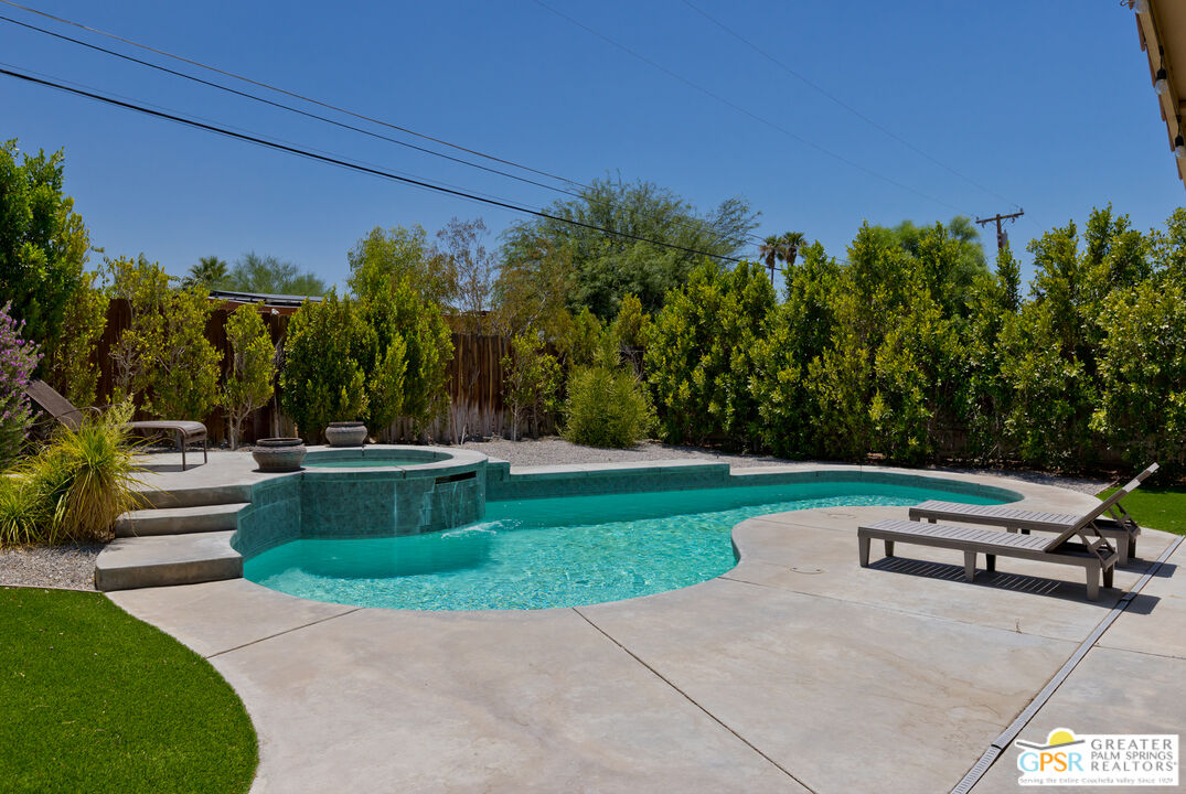 12800 Miracle Hill Road Desert Hot Springs, CA 92240 - Photo 1 of 51 a view of backyard with seating area and green space
