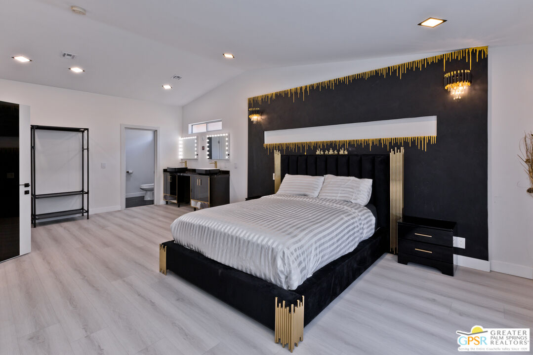 12800 Miracle Hill Road Desert Hot Springs, CA 92240 - Photo 22 of 51 a bed room with a bed and a television