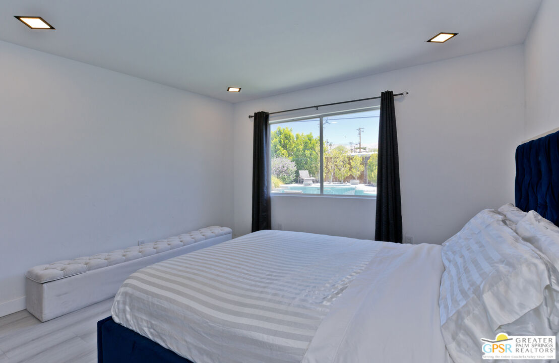 12800 Miracle Hill Road Desert Hot Springs, CA 92240 - Photo 34 of 51 a bedroom with a bed and a window