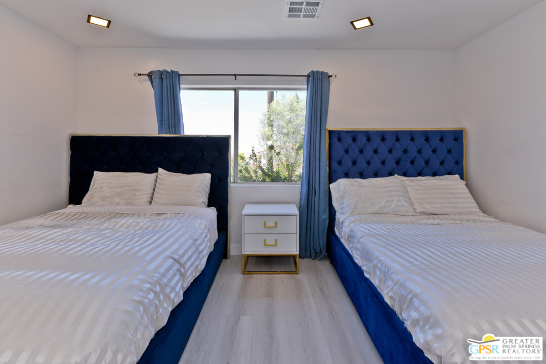 12800 Miracle Hill Road Desert Hot Springs, CA 92240 - Photo 38 of 51 a bedroom with a bed and window