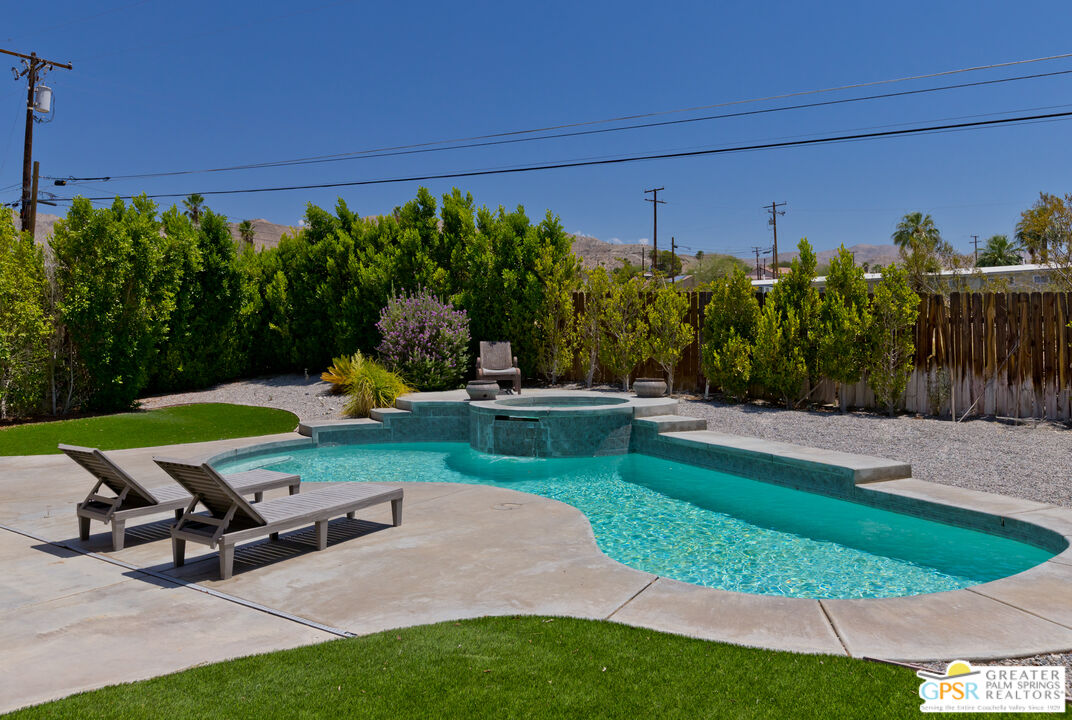 12800 Miracle Hill Road Desert Hot Springs, CA 92240 - Photo 40 of 51 a view of a backyard with plants and outdoor seating