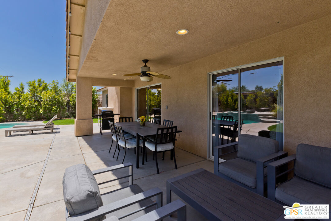 12800 Miracle Hill Road Desert Hot Springs, CA 92240 - Photo 41 of 51 a view of a dining room with furniture window and outside view
