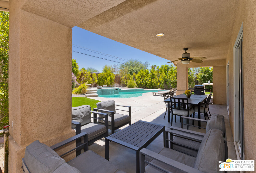 12800 Miracle Hill Road Desert Hot Springs, CA 92240 - Photo 42 of 51 a view of a chairs and table in a patio