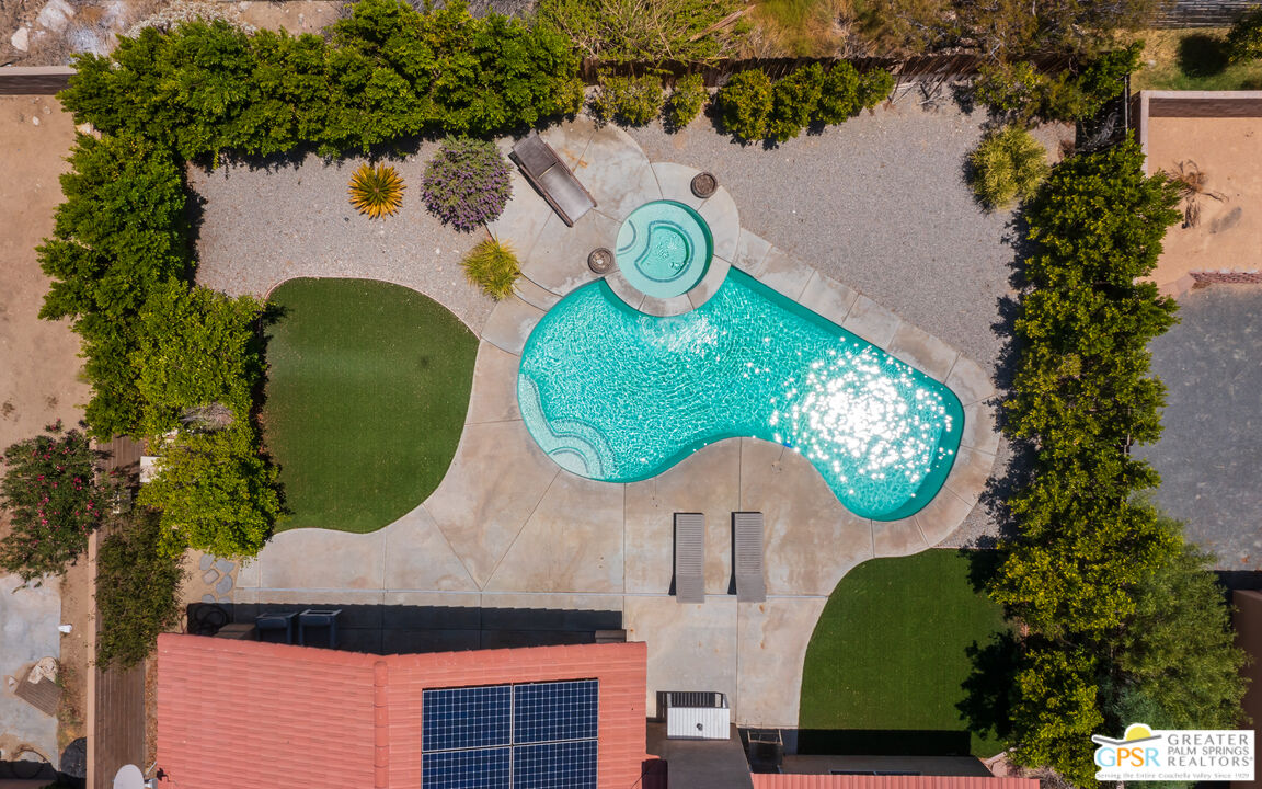 12800 Miracle Hill Road Desert Hot Springs, CA 92240 - Photo 45 of 51 an aerial view of a house with swimming pool and outdoor space