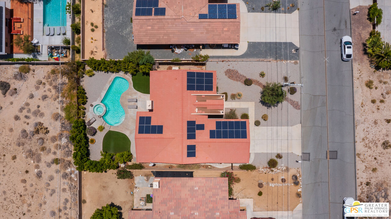 12800 Miracle Hill Road Desert Hot Springs, CA 92240 - Photo 46 of 51 an aerial view of residential house with outdoor space and parking