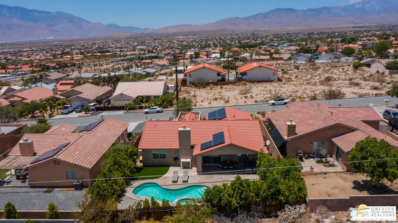 12800 Miracle Hill Road Desert Hot Springs, CA 92240 - Photo 47 of 51 an aerial view of residential houses and outdoor space