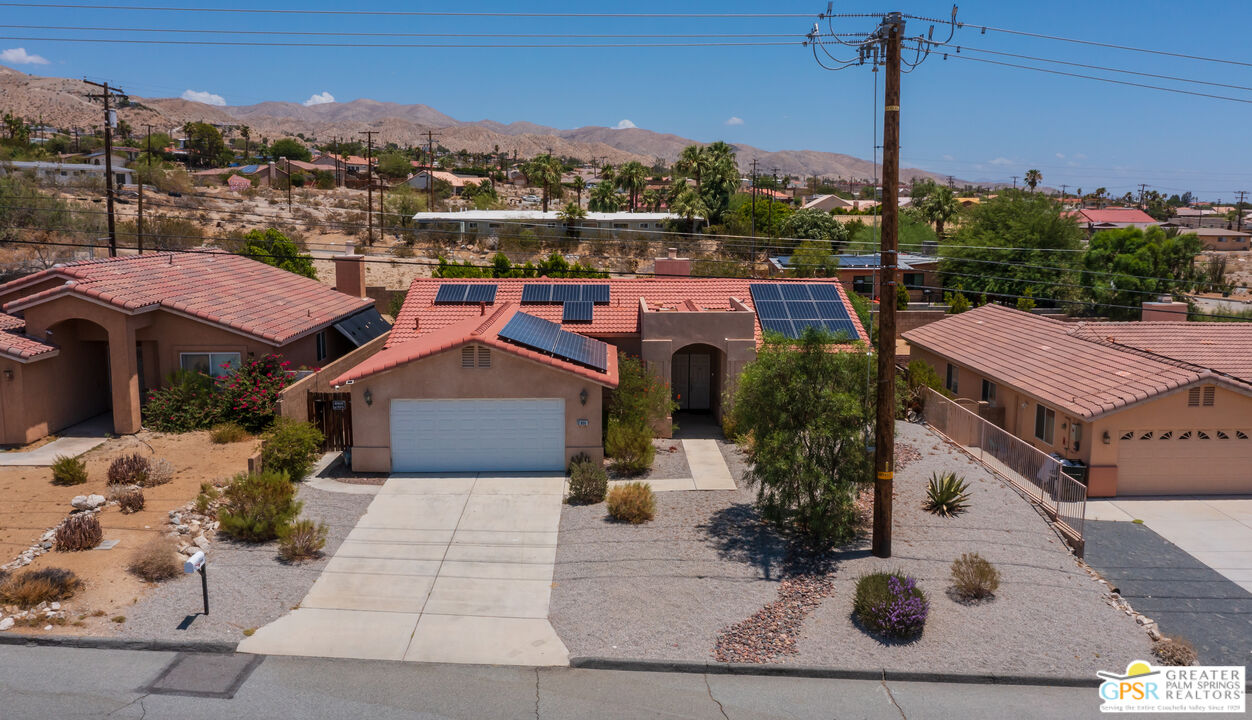 12800 Miracle Hill Road Desert Hot Springs, CA 92240 - Photo 48 of 51 a aerial view of a house with a yard