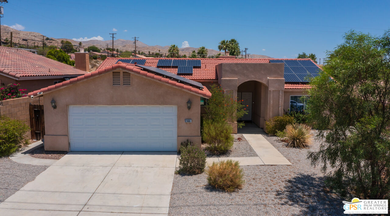 12800 Miracle Hill Road Desert Hot Springs, CA 92240 - Photo 51 of 51 a front view of a house with a yard