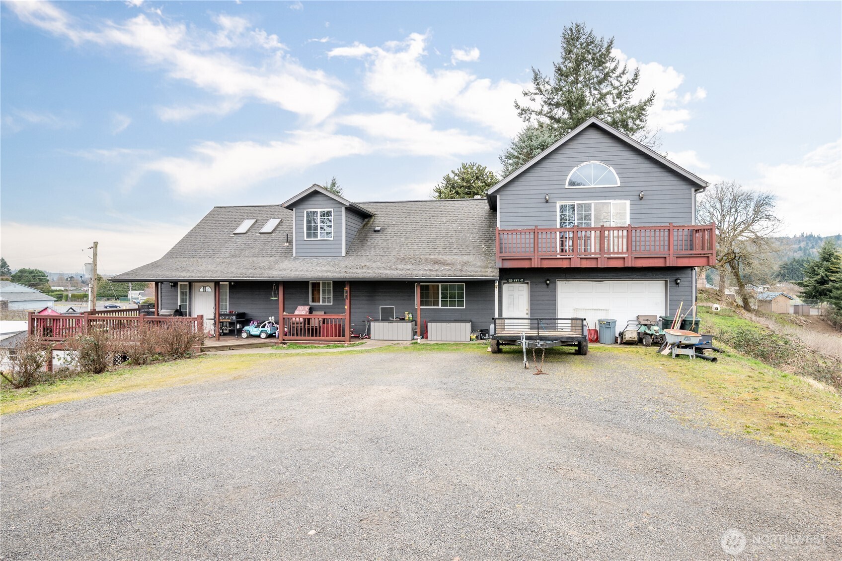 a view of a house with patio and a yard
