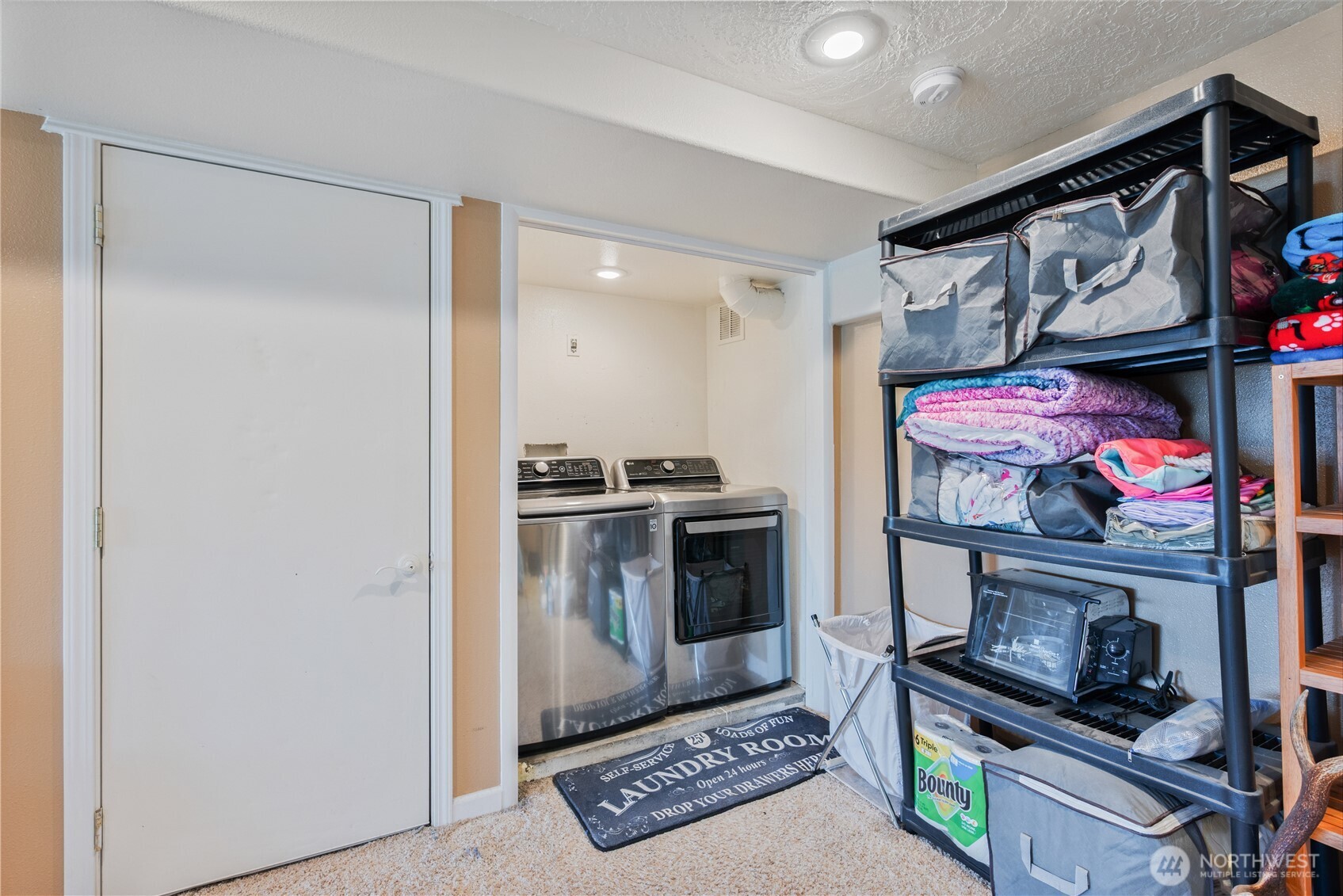 4514 Ohio Street Longview, WA 98632 - Photo 18 of 30 a kitchen with stainless steel appliances granite countertop a stove and a refrigerator