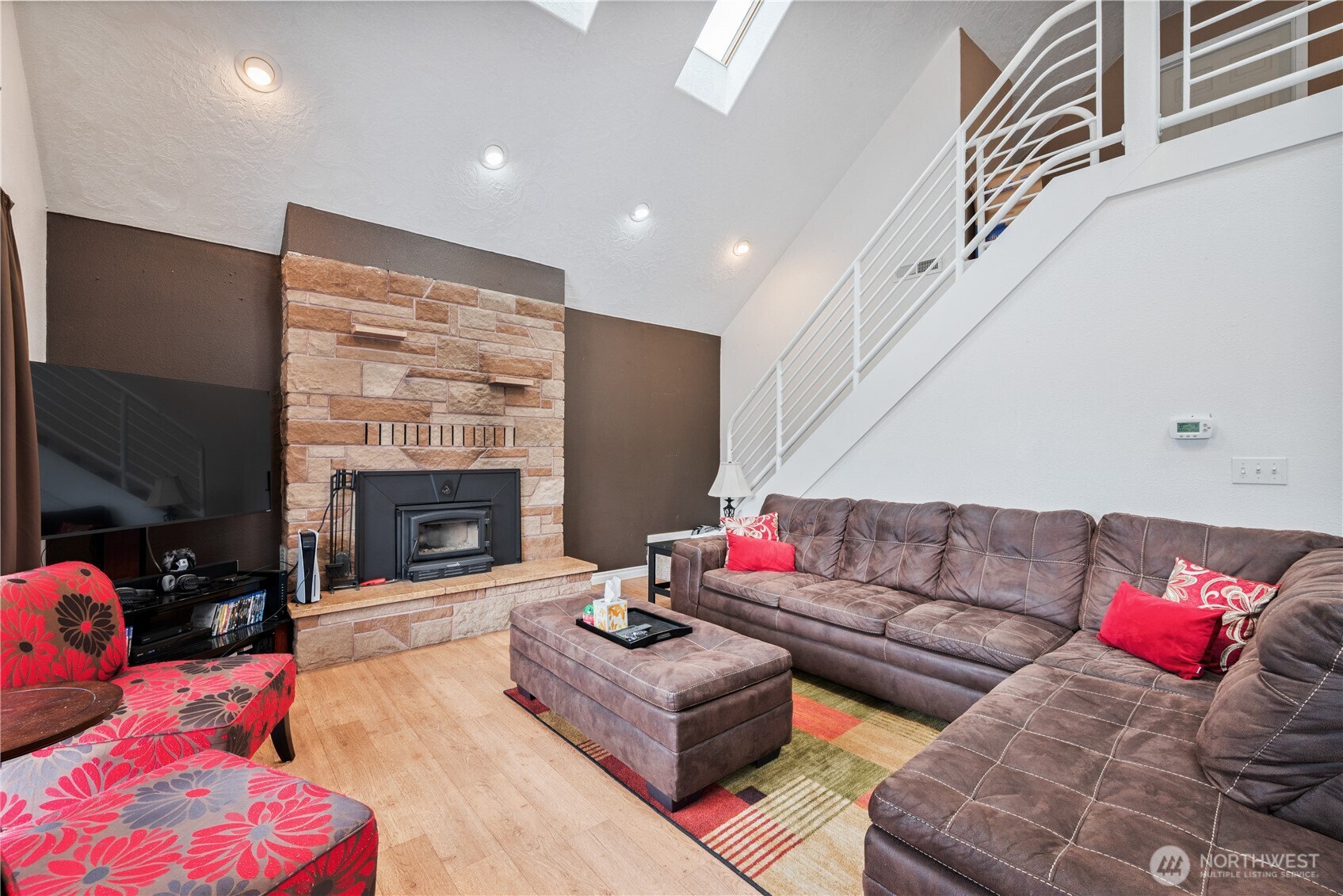 4514 Ohio Street Longview, WA 98632 - Photo 2 of 30 a living room with furniture a fireplace and a flat screen tv