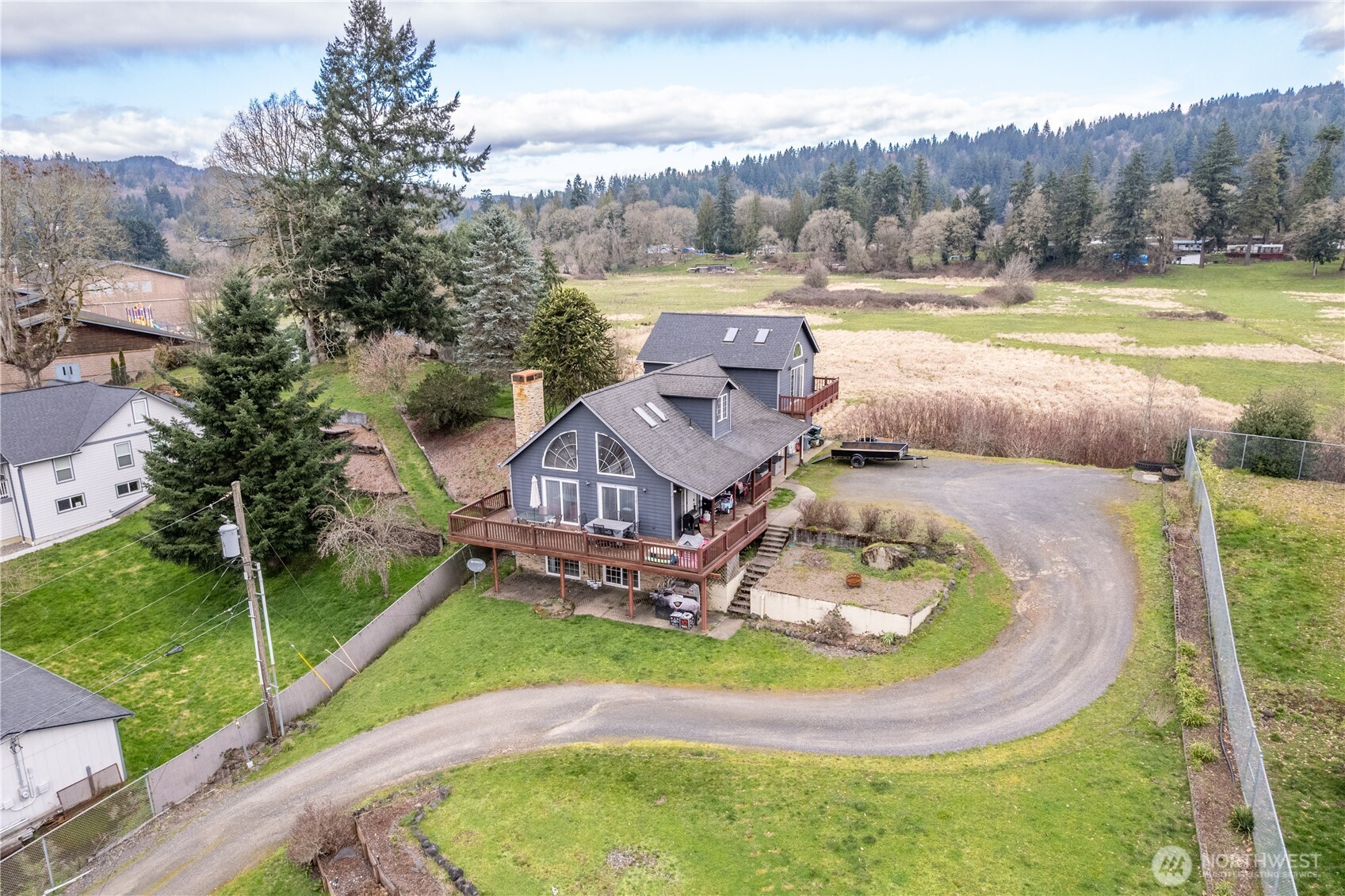 4514 Ohio Street Longview, WA 98632 - Photo 23 of 30 an aerial view of a house with a big yard and palm trees