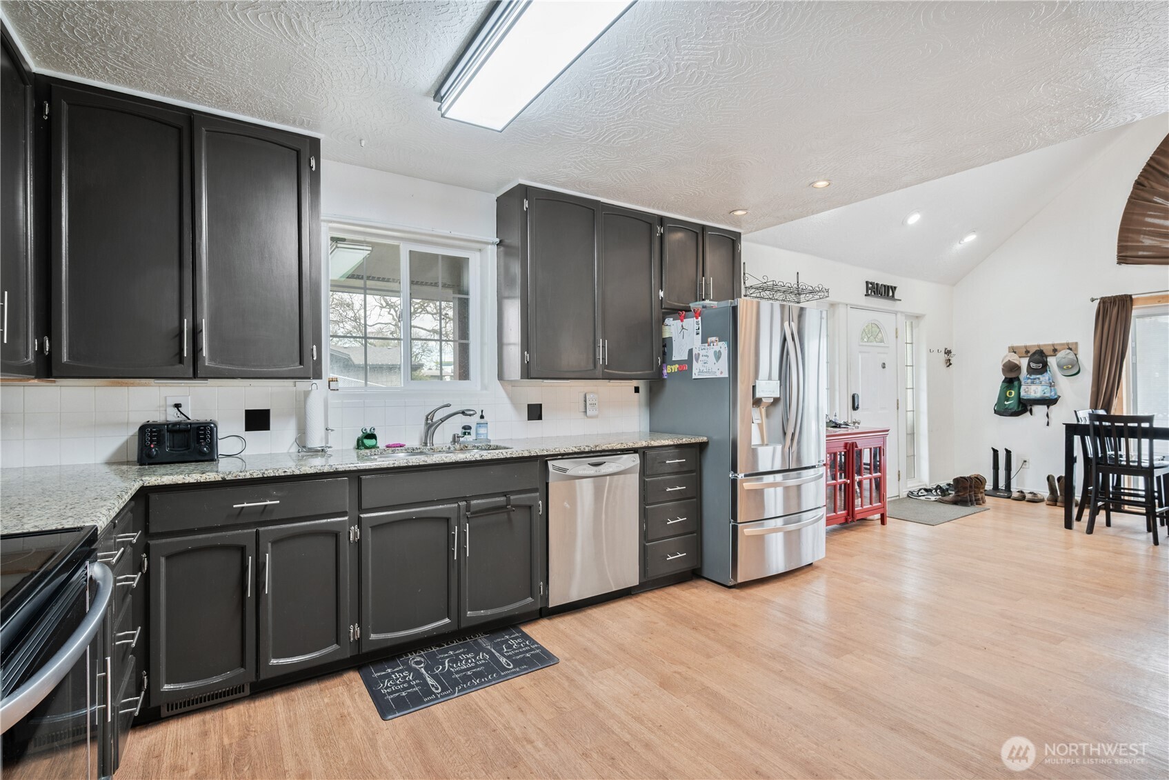 4514 Ohio Street Longview, WA 98632 - Photo 5 of 30 a kitchen with stainless steel appliances a sink stove and refrigerator