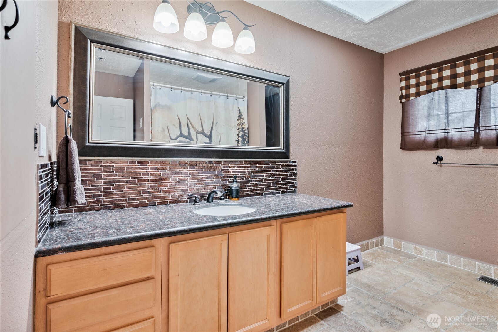 4514 Ohio Street Longview, WA 98632 - Photo 8 of 30 a bathroom with a sink vanity and mirror