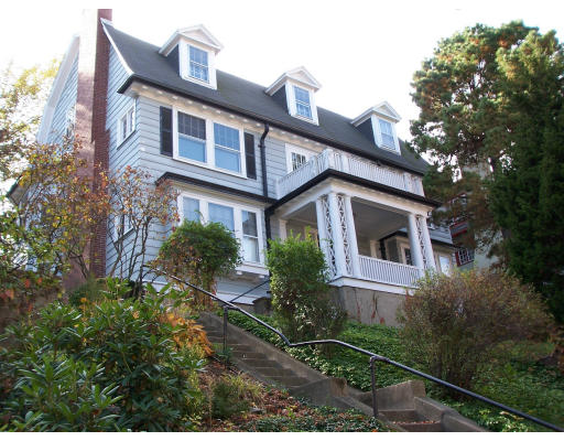 121 University Road Brookline, MA 02445 - Photo 1 of 1 a front view of a house with a yard